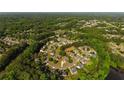 An aerial view of homes with manicured lawns in a quiet, wooded neighborhood at 5015 Preservation Pointe Nw, Kennesaw, GA 30152