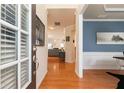 Inviting foyer with hardwood floors, neutral paint, and natural light cascading from the front door at 5888 Cobblestone Creek Cir, Mableton, GA 30126