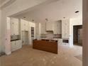 Spacious unfinished kitchen featuring white cabinets, a wood island, and recessed lighting at 933 Mount Carmel Church Ln, Canton, GA 30114