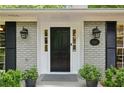 Close-up of the front door showcasing the house number, stylish lighting, and well-maintained entryway at 1130 Angelo Ne Ct, Atlanta, GA 30319