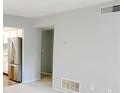 Open floor plan showcasing neutral walls, and stainless steel kitchen appliances at 1818 Huntingdon Chase, Atlanta, GA 30350
