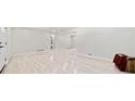 Open living space with luxury vinyl floors leads to the kitchen and bedrooms, a perfect layout for entertaining at 302 Davis Rd, Stockbridge, GA 30281