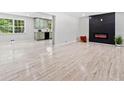 Spacious living room features luxury vinyl floors, an electric fireplace and adjoins the updated kitchen at 302 Davis Rd, Stockbridge, GA 30281