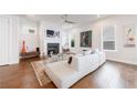 Cozy living room with fireplace, comfortable seating, and ample natural light at 4046 Hazel Nut Ln, Atlanta, GA 30342