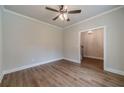 Spacious living room featuring hardwood floors, white trim, neutral walls, and ceiling fan at 1482 Alcovy Station Rd, Covington, GA 30014