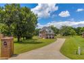 Stately brick home with long driveway and large front yard at 3135 Castlewood Dr, Loganville, GA 30052