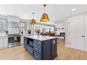 Stylish, open-concept kitchen with an island, modern appliances, and seamless access to the cozy living room at 4304 Lake Laurel Se Dr, Smyrna, GA 30082