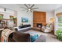 Spacious living room with fireplace, hardwood floors, and modern furniture, ideal for relaxation at 685 Maplelake Dr, Acworth, GA 30101