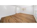 Spacious living room features modern wood flooring and multiple windows at 3652 Platina Park Ct, Decatur, GA 30034