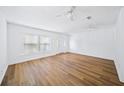 Bright living room with wood-look floors, ceiling fans, and natural light at 3652 Platina Park Ct, Decatur, GA 30034