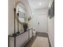 Stylish entryway with a decorative mirror, console table, and a well-lit, welcoming atmosphere at 2366 Haran Dr # 37, Lithonia, GA 30058
