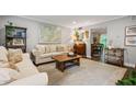 Bright living room featuring neutral walls, hardwood floors, a stylish rug, and comfortable seating arrangements at 120 Biscayne Nw Dr # C13, Atlanta, GA 30309
