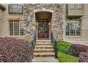 Stone entryway with double doors and manicured landscaping at 1942 N Akin Ne Dr, Atlanta, GA 30345
