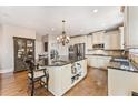 Spacious kitchen with white cabinetry, granite countertops, stainless steel appliances, and island at 3456 Glen Mist Pl, Dacula, GA 30019