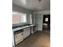 Bright kitchen features a double sink, white cabinets, and modern countertops at 2079 Bencal Se Dr, Atlanta, GA 30316