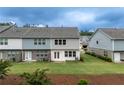 Backyard featuring a well-maintained lawn and a partially fenced area for outdoor enjoyment and privacy at 2089 Lanier Harbor Pt # 2089, Buford, GA 30518