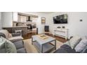 Inviting living room with hardwood floors, stylish furnishings, and an open layout to the kitchen at 1105 Gun Club Nw Rd, Atlanta, GA 30318
