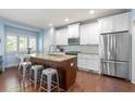 Modern kitchen featuring an island, stainless steel appliances, and ample cabinet space at 1810 Annie Nw St, Atlanta, GA 30318