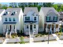 Charming two-story home with inviting front porch, landscaped yard, and black shutters at 458 Bishop Ln, Woodstock, GA 30188