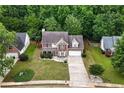 Lovely home with an expansive, well-manicured lawn and mature trees at 2086 Grant Ave, Mcdonough, GA 30252