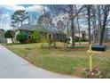 Well-kept brick home featuring neat landscaping and a mailbox at 118 Heritage Way, Peachtree City, GA 30269