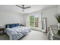 Bedroom with window that allows for lots of natural light and open shutters at 1634 Ponce De Leon Ne Ave # 208, Atlanta, GA 30307