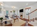 Bright living room featuring a fireplace, hardwood floors, and natural light at 183 Whitefoord Ne Ave, Atlanta, GA 30307