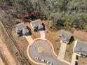 Aerial view of property highlighting home's location on a cul-de-sac with treed surroundings at 2099 Easterwood Ter, Decatur, GA 30032