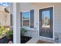 Charming front door with glass panel, sidelight, and gray brick accents at 2099 Easterwood Ter, Decatur, GA 30032