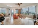Bright living room featuring floor-to-ceiling windows and city views, leather seating, and neutral decor at 2828 Peachtree Nw Rd # 1501, Atlanta, GA 30305