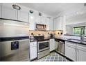 This modern kitchen features stainless appliances, sleek countertops, and ample cabinet space at 1250 Parkwood Se Cir # 3001, Atlanta, GA 30339