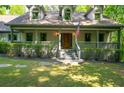Inviting front porch with a charming wood railing and a welcoming entrance at 465 Willowbrook Se Dr, Smyrna, GA 30082