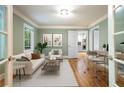 Bright living room with hardwood floors and view of open kitchen and dining area at 465 Willowbrook Se Dr, Smyrna, GA 30082