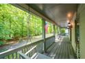 Relaxing porch showcasing serene views of a lush green yard and surrounding trees at 465 Willowbrook Se Dr, Smyrna, GA 30082