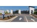 Gated community entrance with landscaped grounds and prominent signage at 1834 Butterfly Way, Marietta, GA 30066
