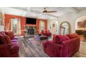 Inviting living room with hardwood floors, fireplace, and coffered ceilings at 1023 Bentley Estates Dr, Dacula, GA 30019