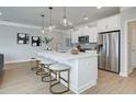 Bright kitchen with stainless steel appliances, island, and barstool seating at 4541 Moray Dr, Mableton, GA 30126