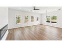 A spacious living room boasts lots of natural light and sleek hardwood floors at 4541 Moray Dr, Mableton, GA 30126