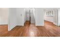 Spacious living room featuring gleaming hardwood floors and classic archway details at 1095 Saint Charles Ne Pl, Atlanta, GA 30306