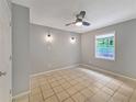 Bedroom with a window, ceiling fan, tiled floors and neutral paint at 1212 Utoy Springs Rd # 46, Atlanta, GA 30331