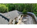 A well-maintained apartment building with balconies and ample parking, surrounded by mature trees at 1212 Utoy Springs Rd # 46, Atlanta, GA 30331