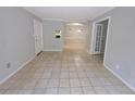 This living room features a tile floor, neutral-tone walls, and an entryway to a dining area, creating an inviting space at 1212 Utoy Springs Rd # 46, Atlanta, GA 30331