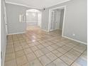 Open-concept living and dining area with tile floors and neutral paint at 1212 Utoy Springs Rd # 46, Atlanta, GA 30331