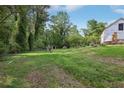 Expansive backyard with lush green grass and mature trees at 2003 Greeson Rd, Dacula, GA 30019
