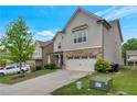 Attractive two-story home with a two-car garage and well-manicured lawn and landscaping at 2320 Ivy Birch Ln, Buford, GA 30519