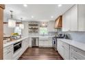 Bright kitchen features white cabinetry, stainless steel appliances, and quartz countertops at 2653 Elkhart Sw Cir, Marietta, GA 30064
