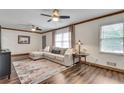 Cozy living room with hardwood floors, a comfortable sectional sofa, and natural light at 2653 Elkhart Sw Cir, Marietta, GA 30064