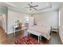 Spacious bedroom featuring tray ceilings, hardwood floors, and neutral tones at 3219 Blackshear Dr, Marietta, GA 30060
