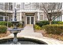 Beautiful fountain outside inviting condo entrance with stone columns at 4100 Paces Se Walk # 2304, Atlanta, GA 30339