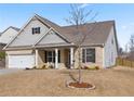 Beautiful home exterior with manicured lawn, covered porch, and neutral color scheme creating a welcoming curb appeal at 7995 Brewton Creek Dr, Cumming, GA 30028